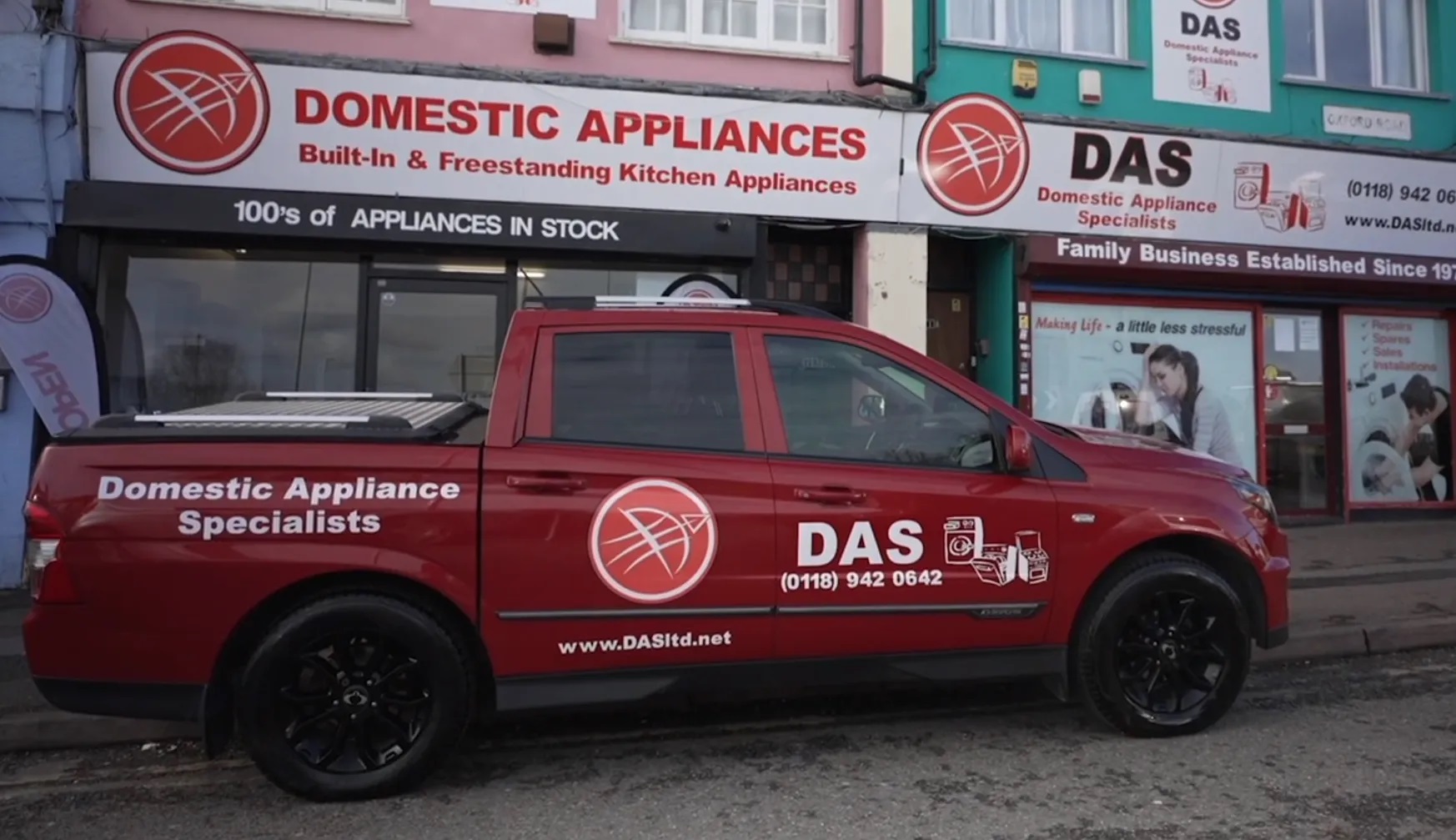 Shop front and truck in company livery.